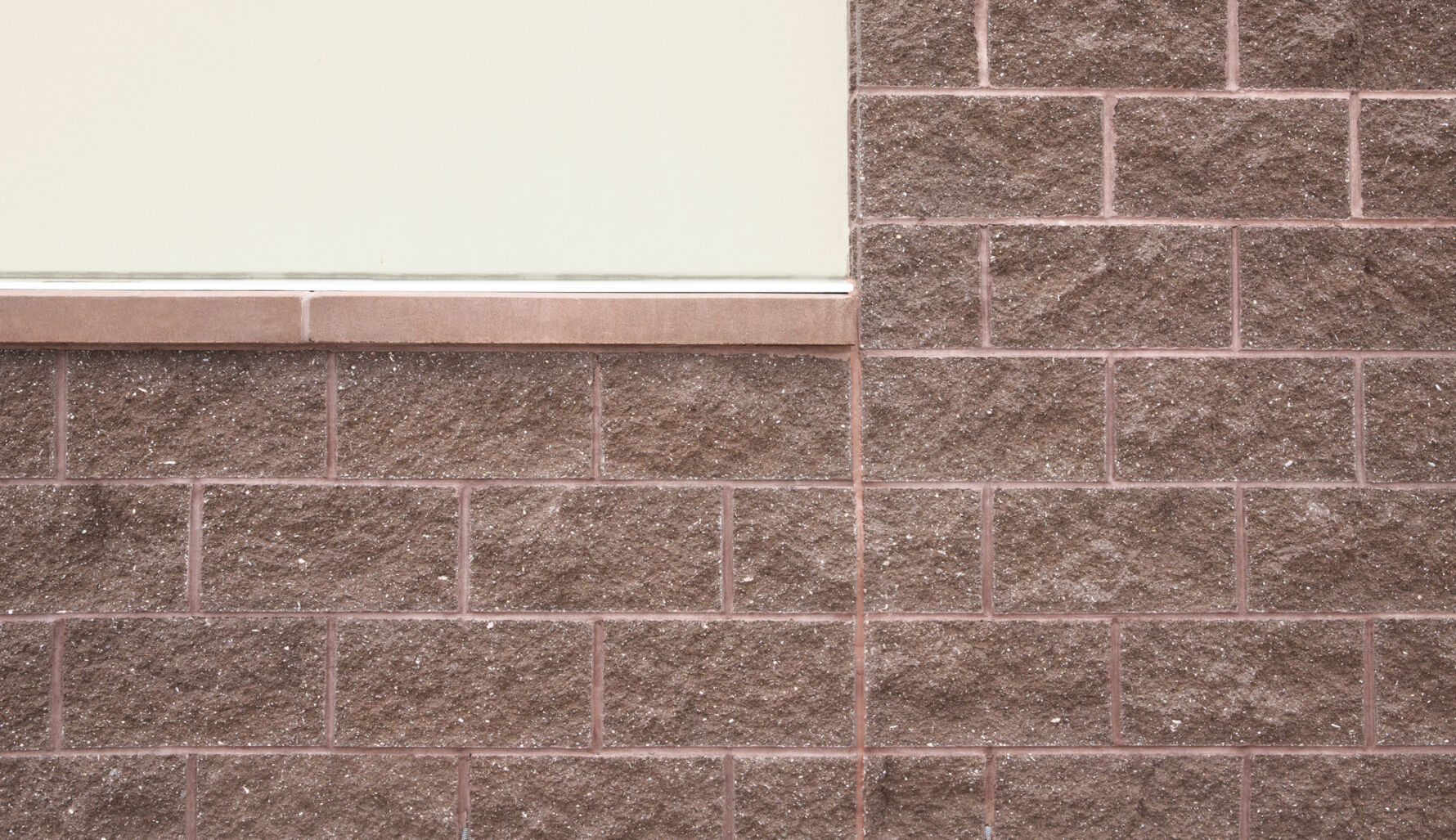 All American Pet Resorts building built with Johnson Concrete Products lightweight CMU and Prestige Masonry split face architectural block.