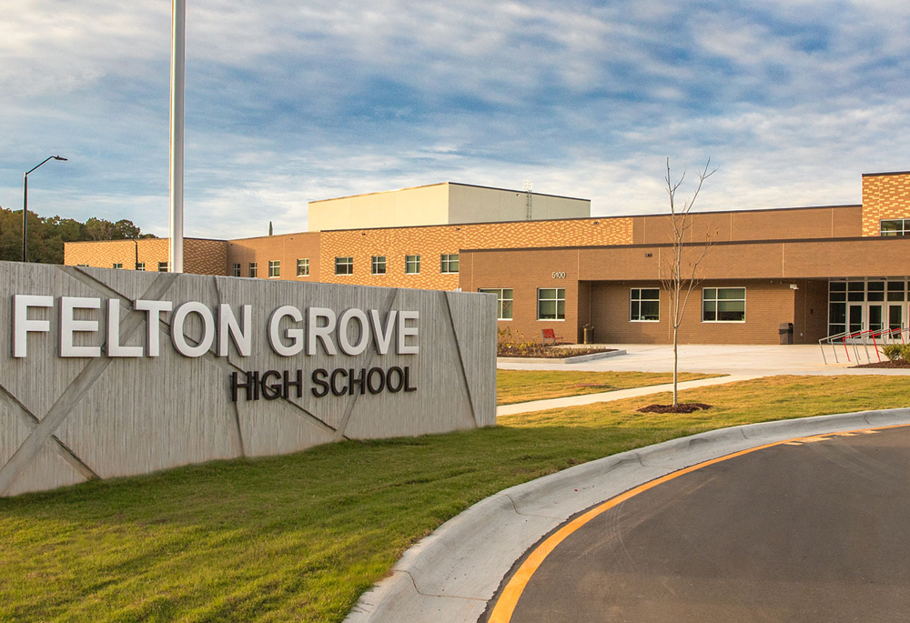 Felton Grove High School entrance in Apex, NC featuring Johnson Concrete Products CMU, Gray Block, ProBlock, and Prestige Masonry Architectural Block in ground face finish.