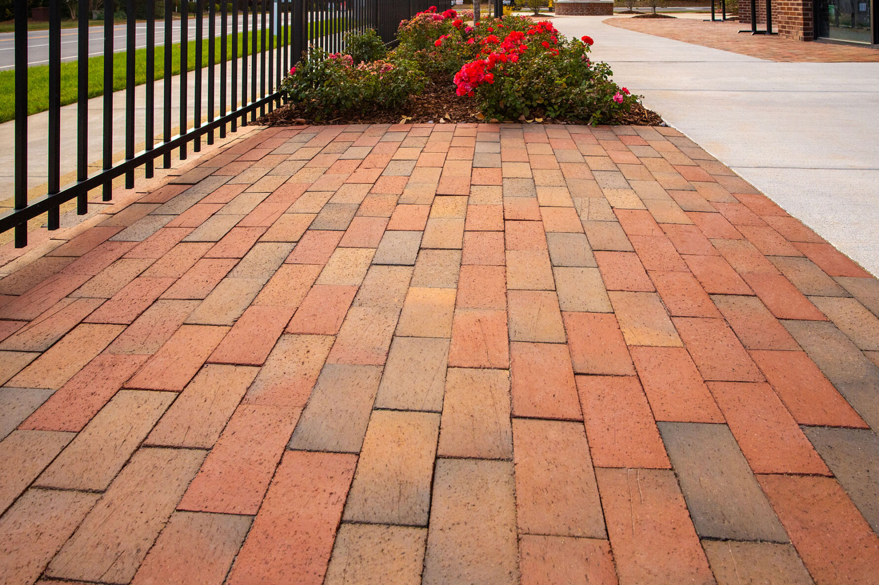 Detail view of Pine Hall Brick pavers in Full Range Red Flash laid in a running bond pattern